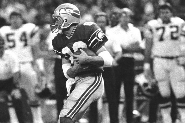 Seattle Seahawks receiver Steve Largent (80) catches a Jim Zorn pass and  moves into the end zone with Washington's Darrell Green (28), holding on in  the second quarter of their NFL game