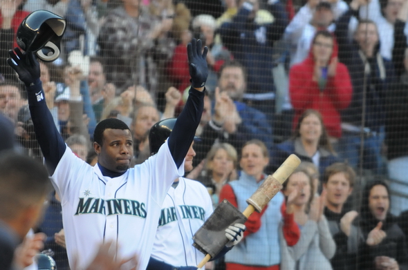 Seattle Mariners' Edgar Martinez watches his sacrifice fly to right field  in the seventh inning against the Oakland Athletics, Friday, Sept. 17,  2004, at Safeco Field in Seattle. The RBI, which scored